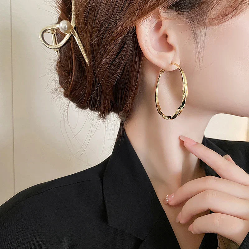 Mobius Twist Gold Hoop Earrings – Classic 50mm Statement Hoops for Women